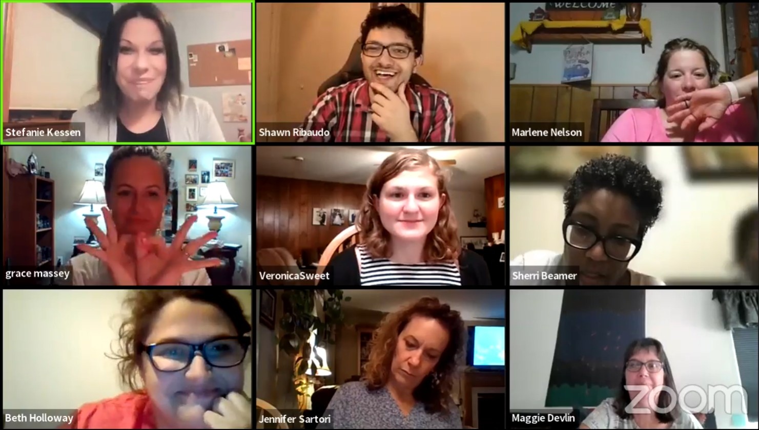 A Signing Room group call: nine people on a video grid, several of them signing