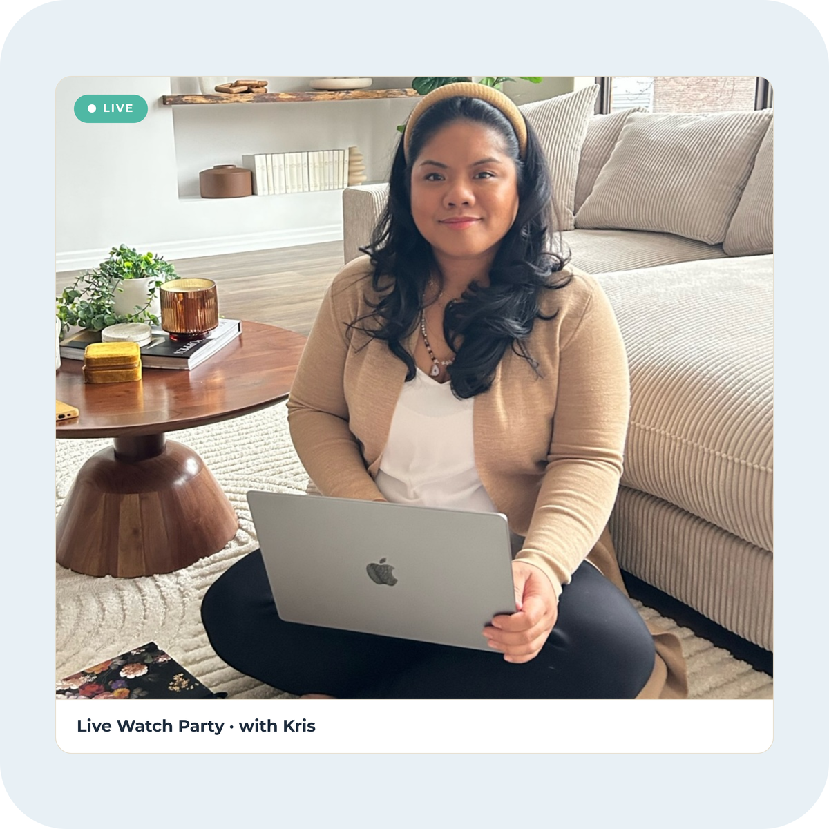 Kris sitting on her living room floor with a laptop, shown in a video call frame marked Live and captioned Live Watch Party with Kris